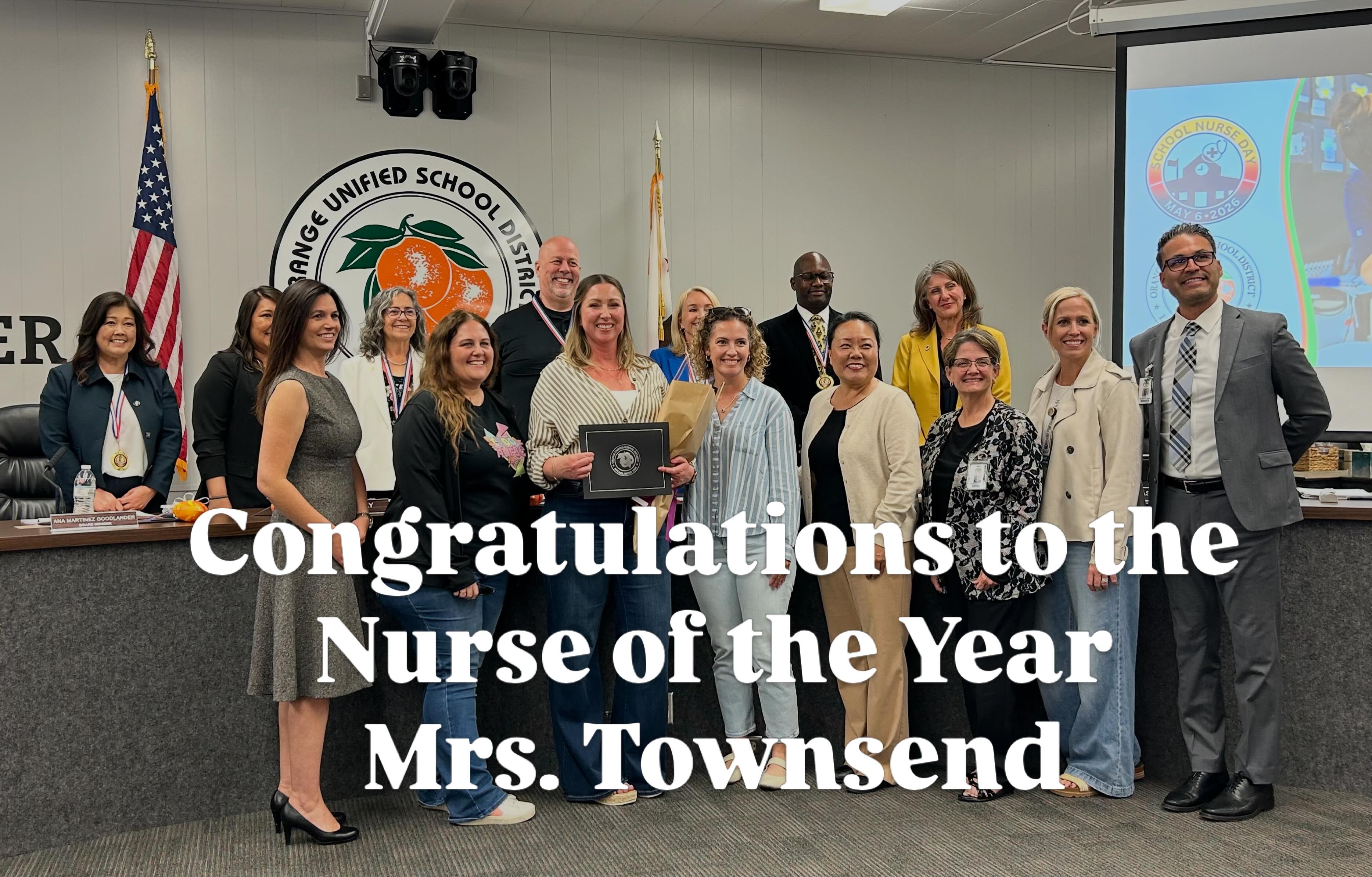 McPherson school nurse Mrs. Townsend surrounded by district colleagues at her Nurse of the Year recognition