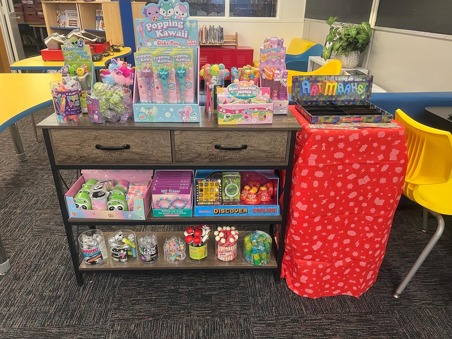 A colorful display of journals, pens, bookmarks, and small student favorites at McPherson’s Book Fair