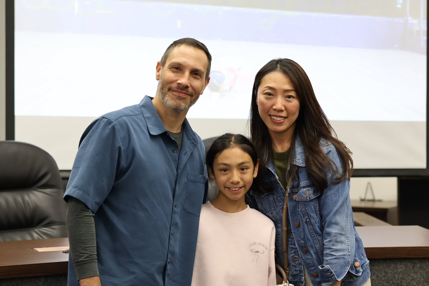 A McPherson student with her family at the Reflections Gallery